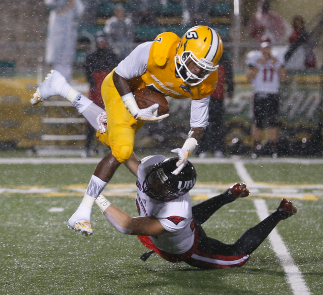 Southeastern Louisiana wide receiver Da'Quan Smith goes airborne to avoid an Incarnate Word defender on Nov. 7, 2015. (RoadTripSports photo by Kendall Webb)